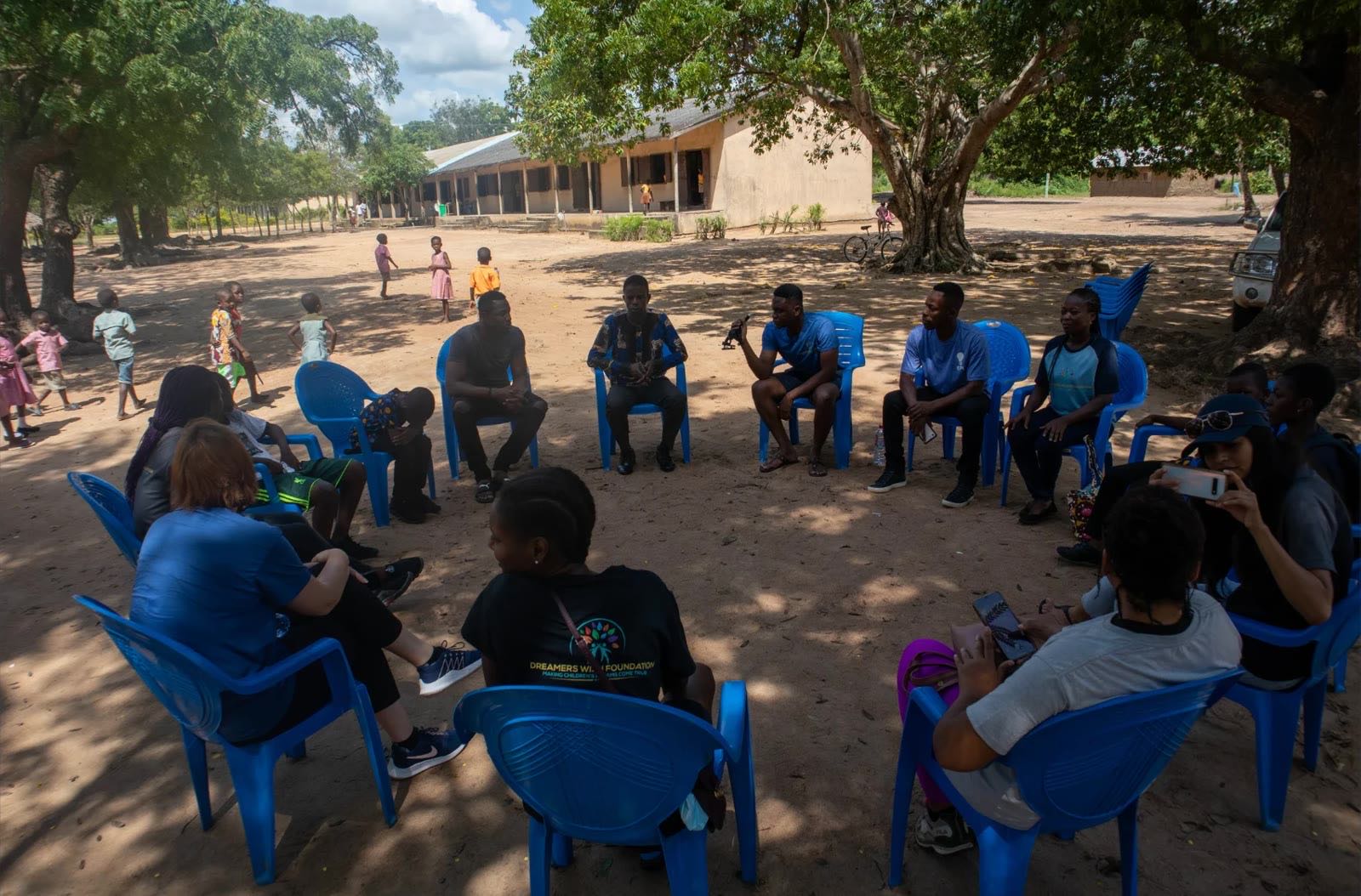 Community leaders gathered in a circle in Ghana