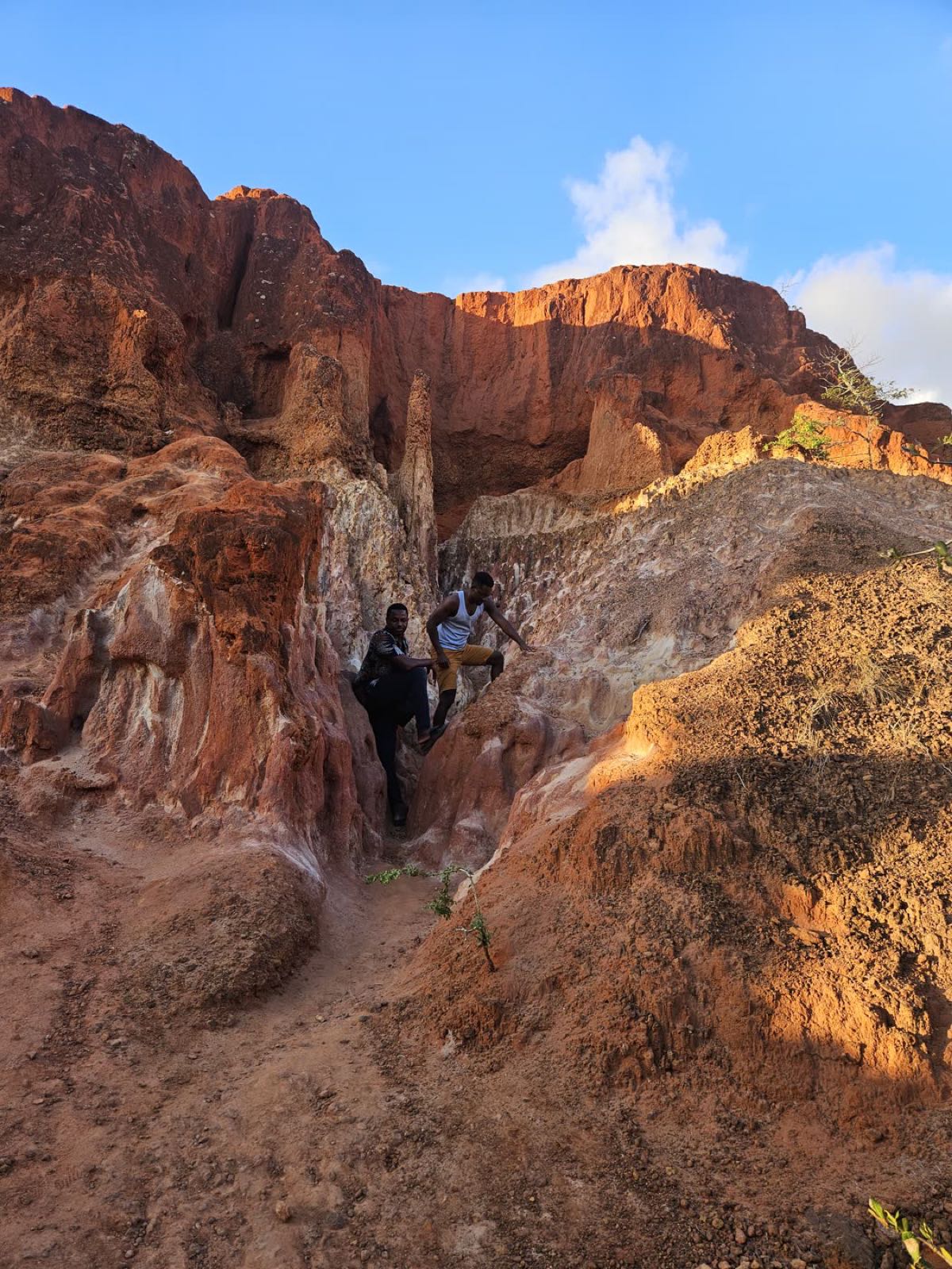 Volunteers exploring the sandstone canyon