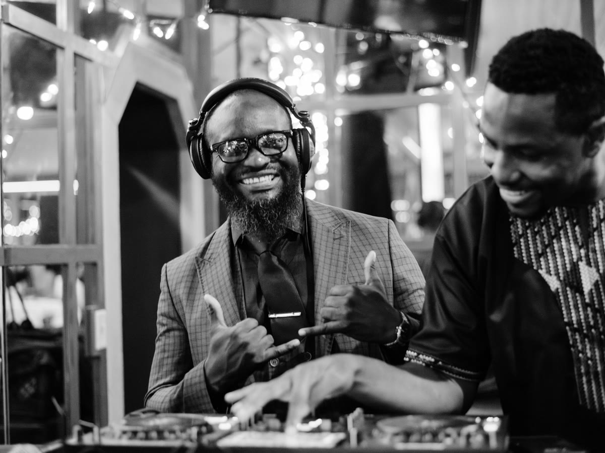 The DJ smiling at the turntables