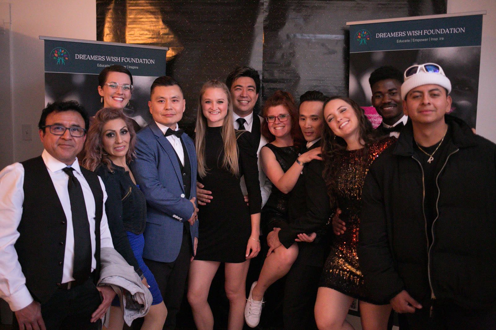 A group of guests posing on the red carpet