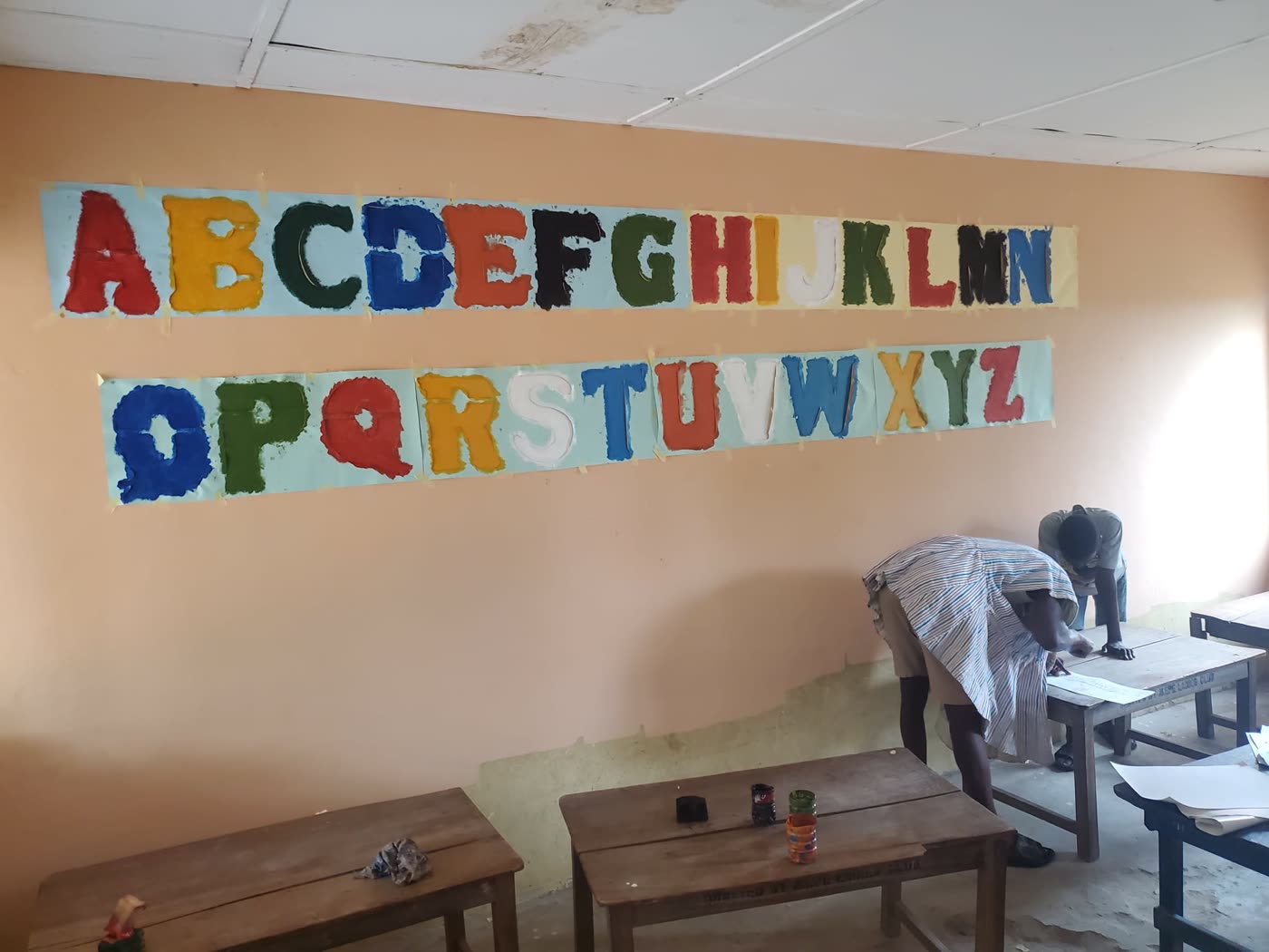 A colorful alphabet painted on a classroom wall