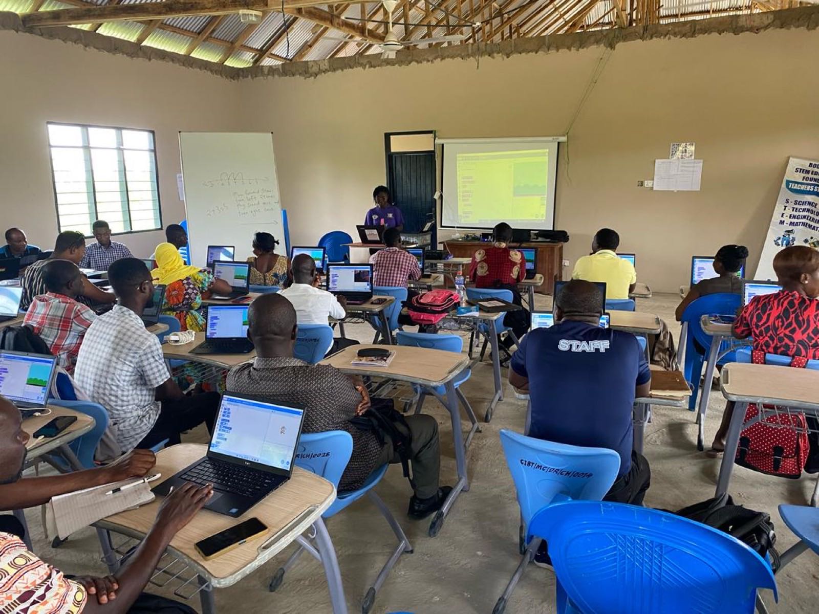 Teachers learning on laptops in a computer lab